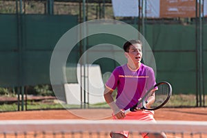 Young tennis player prepares for receiving the important servis