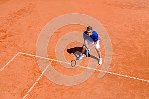 Young Tennis Player Waiting for the First Serve