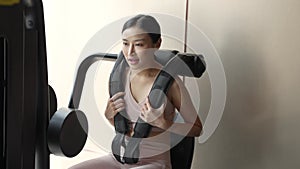 Young Thai Adult Working Out in a Gym Room