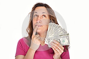 Young thoughtfully woman with money