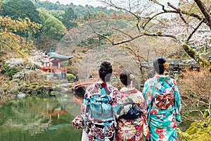 Young three girl wearing Japan kimono standing in front of Daigoji Temple in Kyoto, Japan.