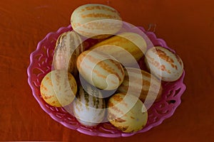 Young tigger melon collection in a bowl