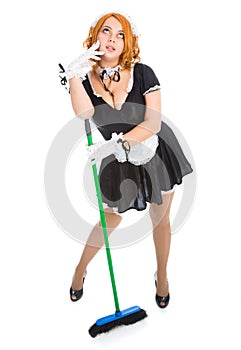 Young tired housemaid with broom