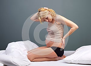 Young tired pregnant woman