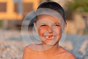 Young toothless boy at the beach