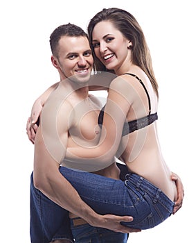 A young topless couple embracing