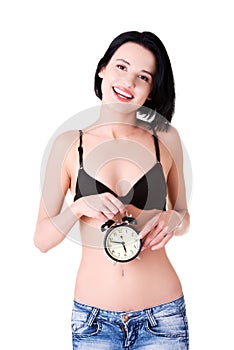 Young topless woman with alarmclock photo