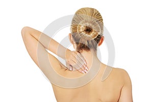 Young topless woman with back pain