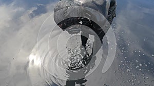 Young Tourist Bather Man Covered with Black Medical Mud at the Lake of Salt Water. Salty Black Dirt Is Good For People