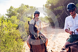 Young Tourist Couple Horseback Riding