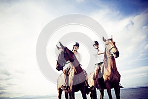 Young Tourist Couple Horseback Riding