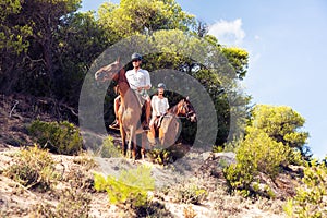 Young Tourist Couple Horseback Riding