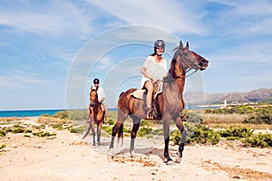 Young Tourist Couple Horseback Riding