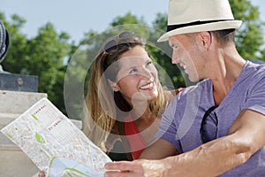 young tourist couple with map outdoors
