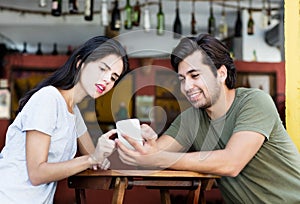 Young tourist couple posting picture from vacation photo