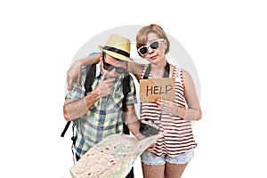 Young tourist couple reading city map looking lost and confused loosing orientation with girl carrying travel backpack