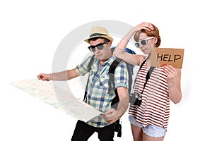 Young tourist couple reading city map looking lost and confused loosing orientation with girl carrying travel backpack