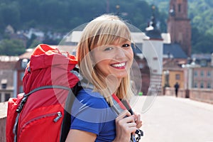 Young tourist in Europe laughing at camera