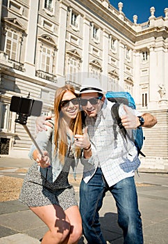 Young tourist friends couple visiting Spain in holidays students exchange taking selfie picture