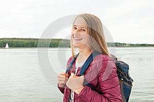 Young tourist girl with a backpack