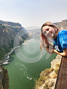 Young tourist girl on vacation at Twin Falls in Idaho