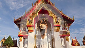 Young Tourist Girl in White Dress and Big Straw Hat Taking Photo with Mobile Phone of Thai Buddhist Temple. Phuket