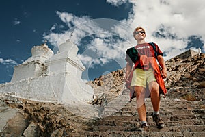 Young tourist man visit the tibetian holy places in Himalaya mountain