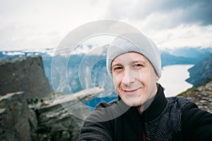 Young Tourist Taking Selfie Against The Backdrop