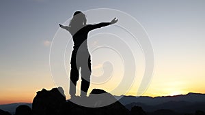 Young Tourist Woman Rising Up Hands on the Top  with Amazing Sunrise on Background. 4K Slowmotion Travel and Freedom Lifestyle