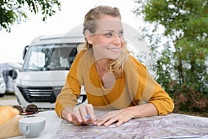 young tourist woman searching right direction on map