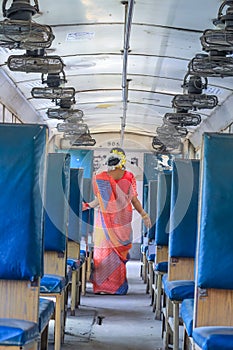 Young tourist woman at train waiting to take off. Tourism and lifestyle concept. Back view