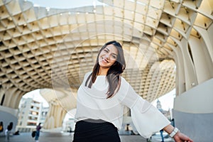 Young tourist woman on vacation in Andalusia, visiting Setas de Sevilla- Metropol Parasol at the La EncarnaciÃ³n square in Seville