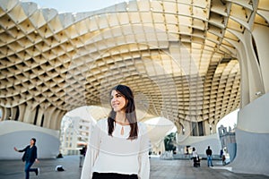 Young tourist woman on vacation in Andalusia, visiting Setas de Sevilla- Metropol Parasol at the La EncarnaciÃ³n square in Seville