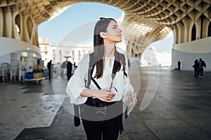 Young tourist woman on vacation in Andalusia, visiting Setas de Sevilla- Metropol Parasol at the La EncarnaciÃ³n square in Seville