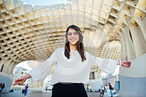 Young tourist woman on vacation in Andalusia, visiting Setas de Sevilla- Metropol Parasol at the La EncarnaciÃ³n square in Seville