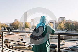 Young tourist woman on vacation with a map