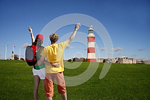 Young tourists near Plymouth lighthouse, UK