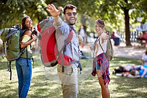 Young tourists posing in a park