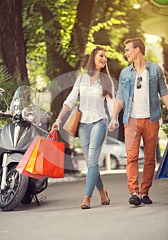 Young tourists in shopping tour