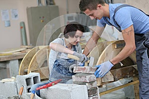 Young trainees in masonry training