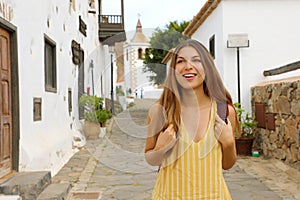 Young traveler girl visits small colonial village of Betancuria, Canary Islands, Spain photo