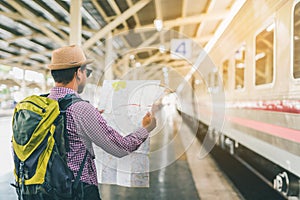 Young traveler man at platform train station. Traveling concept