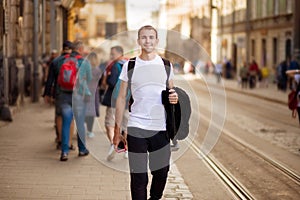 Young traveler man walk alone by old europen street