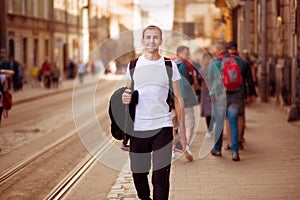 Young traveler man walk alone by old europen street