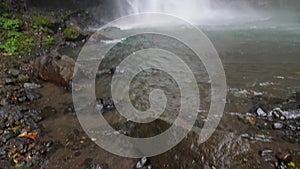 Young Traveler Man Walking to Amazing Jungle Waterfall. First Person Gopro View in 4K, Slowmotion Cinematic Travel Lifestyle