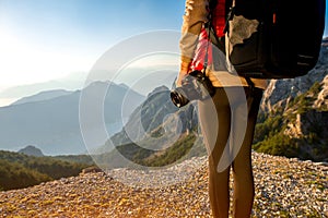 Young traveler photographer on the mountain