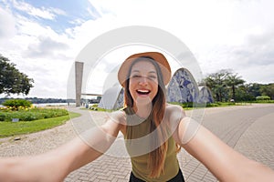 Young traveler woman takes self portrait in Belo Horizonte, Minas Gerais, Brazil