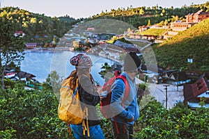 Young traveller enjoying a looking at sun rise. Travel nature. Travel relax outdoor, Romantic couples