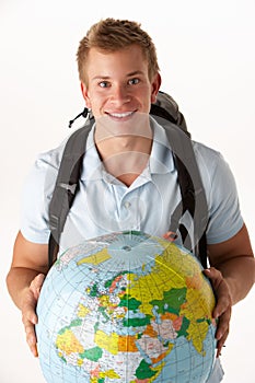 Young traveller with globe photo