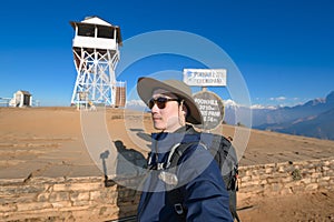 Young traveller trekking in Poon Hill view point in Ghorepani, Nepal